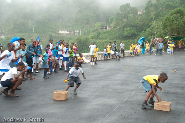 Students compete in the potato race during sports day at the Cascade Primary School in the Blue Mountains of Portland, Jamaica on March 27 2013. Sports day was held on a newly repaired stretch of road which had previously been destroyed by a landslide since 2004.