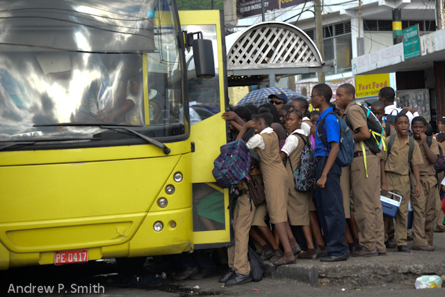 School children boarding a bus.