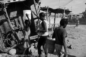 Residents of St. Marc collect water on February 22, 2004. 